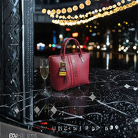 Elegant Red Structured Tote Handbag with Top Handles, Tassel Charm & Vertical Stripe Design